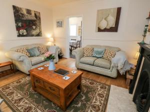 a living room with a couch and a coffee table at Yeoman Terrace in Marske-by-the-Sea