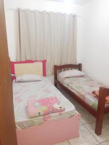 En eller flere senge i et værelse på Casa amarela 02 jdm moema