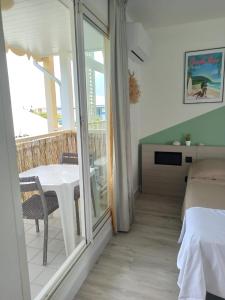 Ένα ή περισσότερα κρεβάτια σε δωμάτιο στο Kukumi's Suite Manganao