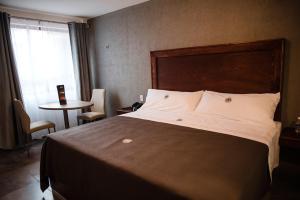 מיטה או מיטות בחדר ב-Hotel RM Avandaro