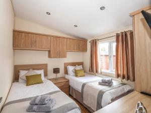 Cama ou camas em um quarto em Wainwright Lodge