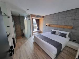 Postel nebo postele na pokoji v ubytování Nirundorn Resort Chaam