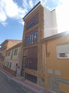 an old building on the corner of a street at Apartamento de lujo en la Sierra in Becerril de la Sierra