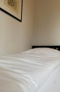 Postel nebo postele na pokoji v ubytování Hotel Sonderborg