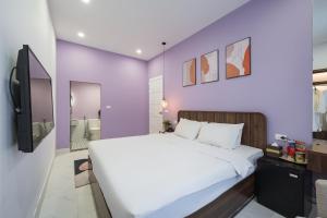 Rúm í herbergi á C o r o n a Hanoi House