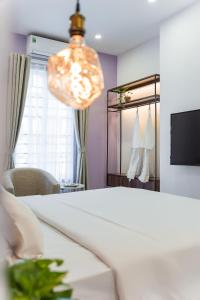 TV a/nebo společenská místnost v ubytování C o r o n a Hanoi House