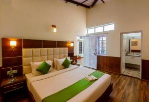 Tempat tidur dalam kamar di Rosewood by Nature Resorts