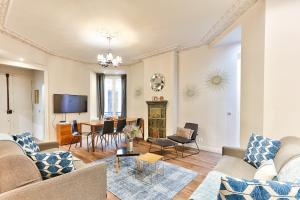 a living room with a couch and a table at 57-LUXURY PARISIEN HOME SEBASTOPOL 1 (2G) in Paris