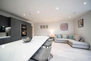 a kitchen and living room with a white counter top at W. Queen St. Apt. in Broughty Ferry