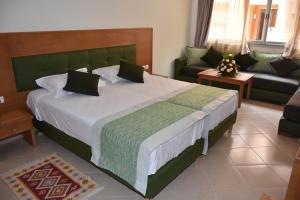 Postel nebo postele na pokoji v ubytování Hotel Residence Imiplage