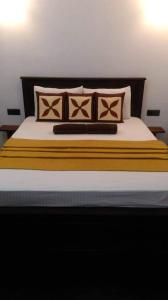 Voodi või voodid majutusasutuse New green leaf resort toas