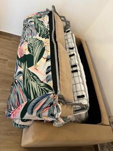 a suitcase is sitting on top of the floor at Apartamentos Atlanterra COSTA Y SOL in Zahara de los Atunes