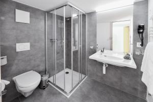 Koupelna v ubytování Hotel Wasserfall