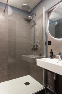 a bathroom with a shower and a sink at Ibis Marseille Centre Prefecture in Marseille