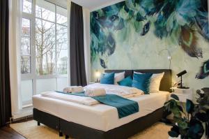 Кровать или кровати в номере HOMELY STAY Studio 9 - Stylish & Convenient Self-Check-In Studio in Munich - 15min from Oktoberfest