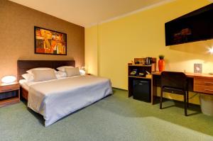 Postel nebo postele na pokoji v ubytování Hotel Hermes