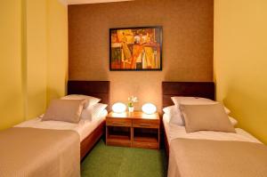 Postel nebo postele na pokoji v ubytování Hotel Hermes
