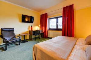 Postel nebo postele na pokoji v ubytování Hotel Hermes