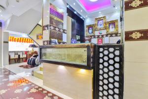 a store with a sign in the middle of a room at Rahab Hotel in Dubai