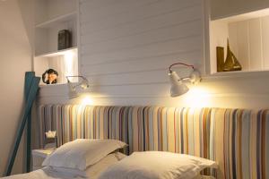 a person taking a picture of a bed in a room at Escape Boutique B&B in Llandudno