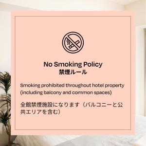 a sign that reads no smoking policy smoking prohibited throughout hotel property at Section L Asakusa East in Tokyo
