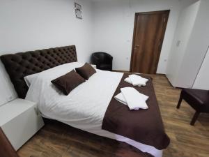 Rúm í herbergi á Sobe i Apartmani Casa Mia