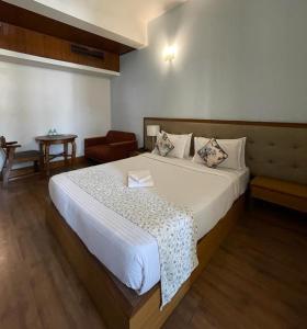 Ένα ή περισσότερα κρεβάτια σε δωμάτιο στο Hotel Tragopan