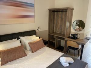 Postel nebo postele na pokoji v ubytování Olive Garden Hotel