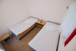 Un pat sau paturi într-o cameră la Casute Valea Zanelor