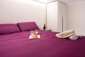 Säng eller sängar i ett rum på Efihouse Lago Maggiore
