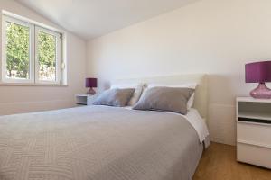 Posteľ alebo postele v izbe v ubytovaní MODERN apartment OMIS