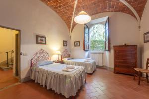 Postel nebo postele na pokoji v ubytování Agriturismo I Bonsi + 37 fotografií