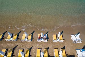 an overhead view of chairs and chairs on the beach at Side Beach Hotel in Side +61 photos
