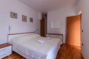 Posteľ alebo postele v izbe v ubytovaní Apartments Zdena