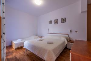 Posteľ alebo postele v izbe v ubytovaní Apartments Zdena