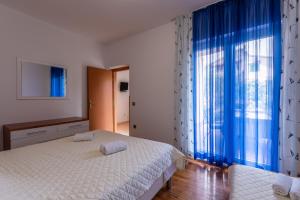 Postel nebo postele na pokoji v ubytování Apartments Zdena