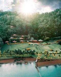 an aerial view of a resort with a golf course at Kunken Boutique Hotel & Spa in Puerto Jiménez