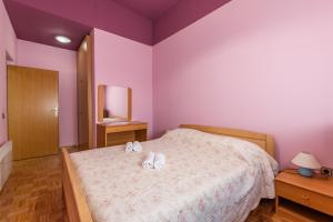 Posteľ alebo postele v izbe v ubytovaní Apartments Zdena