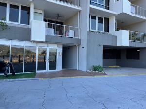 an empty parking lot in front of a building at Euodia Unit 1102 in Nelly Bay