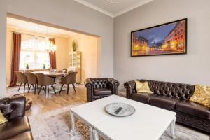 a living room with a couch and a table at Villa an der Bode in Thale