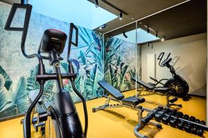 a gym with two exercise bikes in a room at Hotel Liberte 33 BW Premier Collection in Poznań