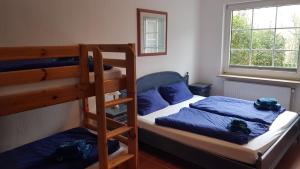 Ένα ή περισσότερα κρεβάτια σε δωμάτιο στο Ferienhaus Astrid Lindgren