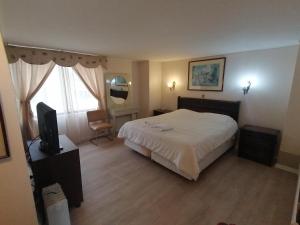 Кровать или кровати в номере Hotel Cantamar