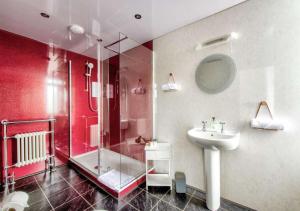 a bathroom with a sink and a shower and a toilet at The Castle Hotel in Berwick-Upon-Tweed