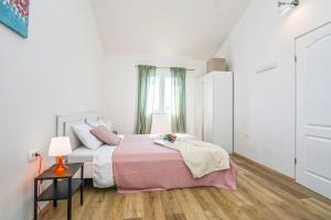 Posteľ alebo postele v izbe v ubytovaní Villa Dika Nin