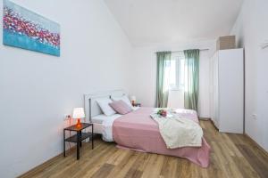 Posteľ alebo postele v izbe v ubytovaní Villa Dika Nin