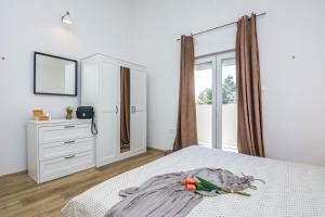 Posteľ alebo postele v izbe v ubytovaní Villa Dika Nin