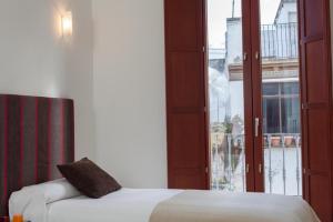 Posteľ alebo postele v izbe v ubytovaní Apartamento Puerta del Arenal - Kainga Homes