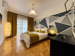 Posteľ alebo postele v izbe v ubytovaní EPaN Luxury Apartments