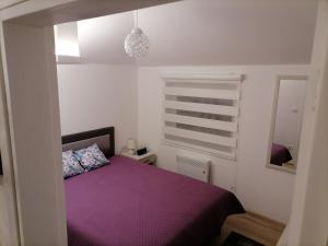 Katil atau katil-katil dalam bilik di Apartman Zlatar Omiljena